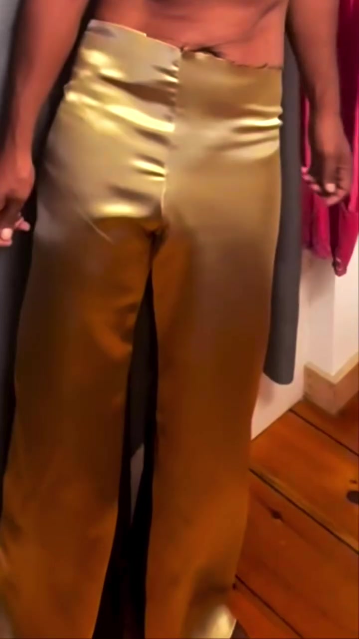 Kristopher wearing newly made gold satin trousers.